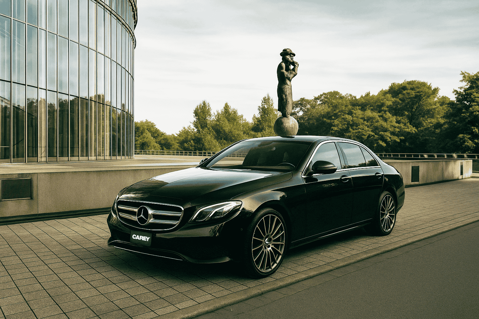 A black Mercedes-Benz sedan parked on a paved area